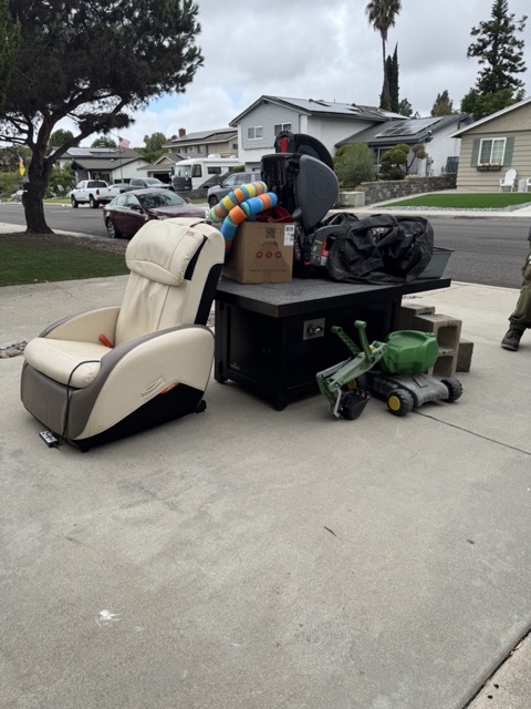 Massage chair and fire table at the curb in San Diego