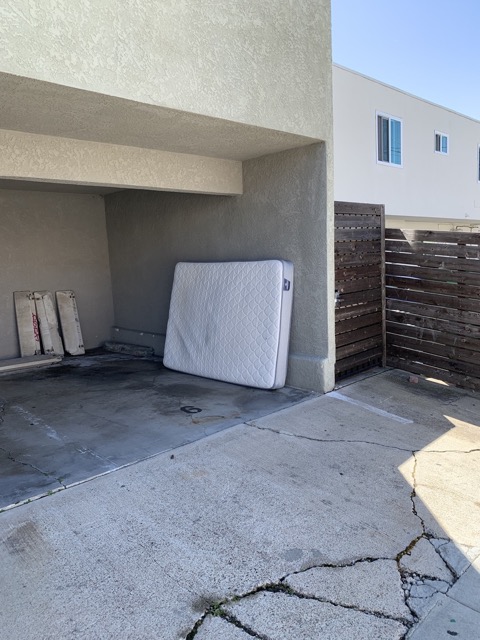 Mattress staged in a carport for same day pickup